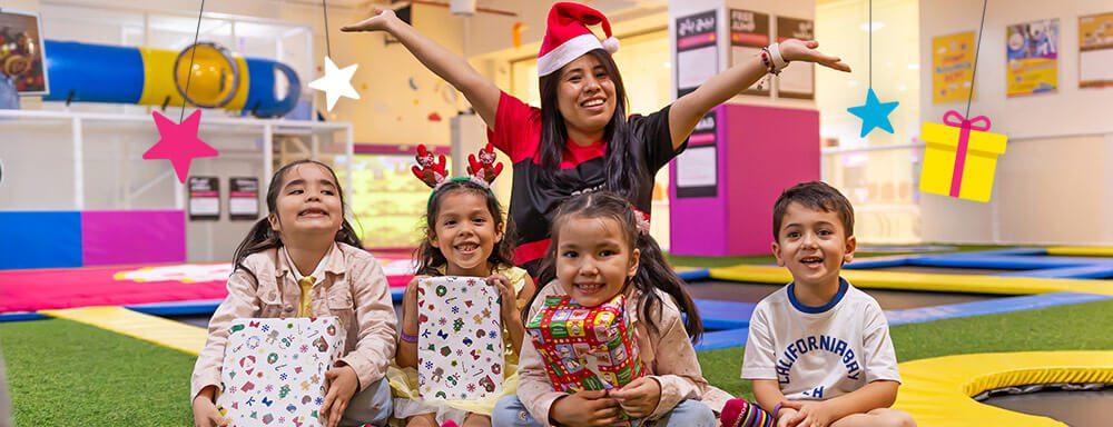 Kids receiving gifts at miniBOUNCE during 12 days of giveaways